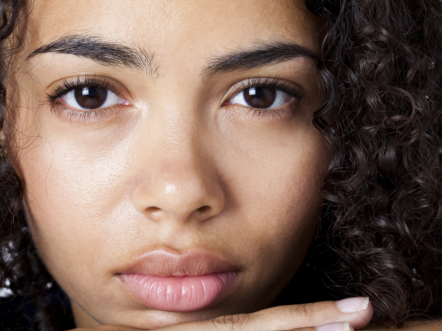 "A close up of a face of a young, beautiful girl in her twenties."