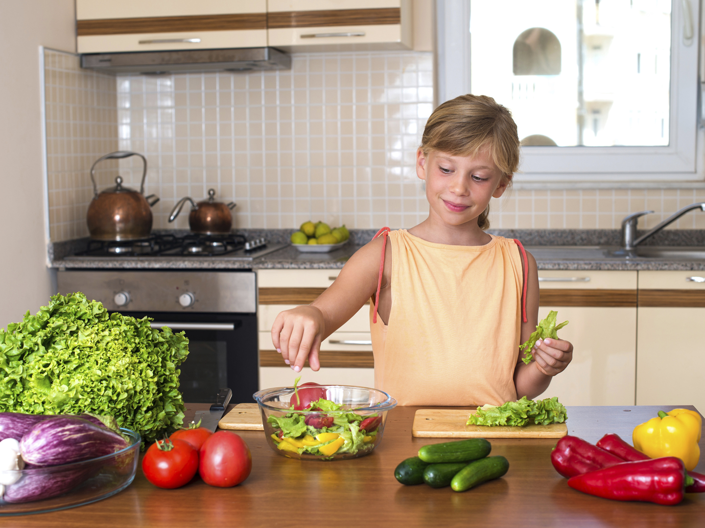 Young Girl Cooking. Healthy Food - Vegetable Salad. Diet. Dieting Concept. Healthy Lifestyle. Cooking At Home. Prepare Food.