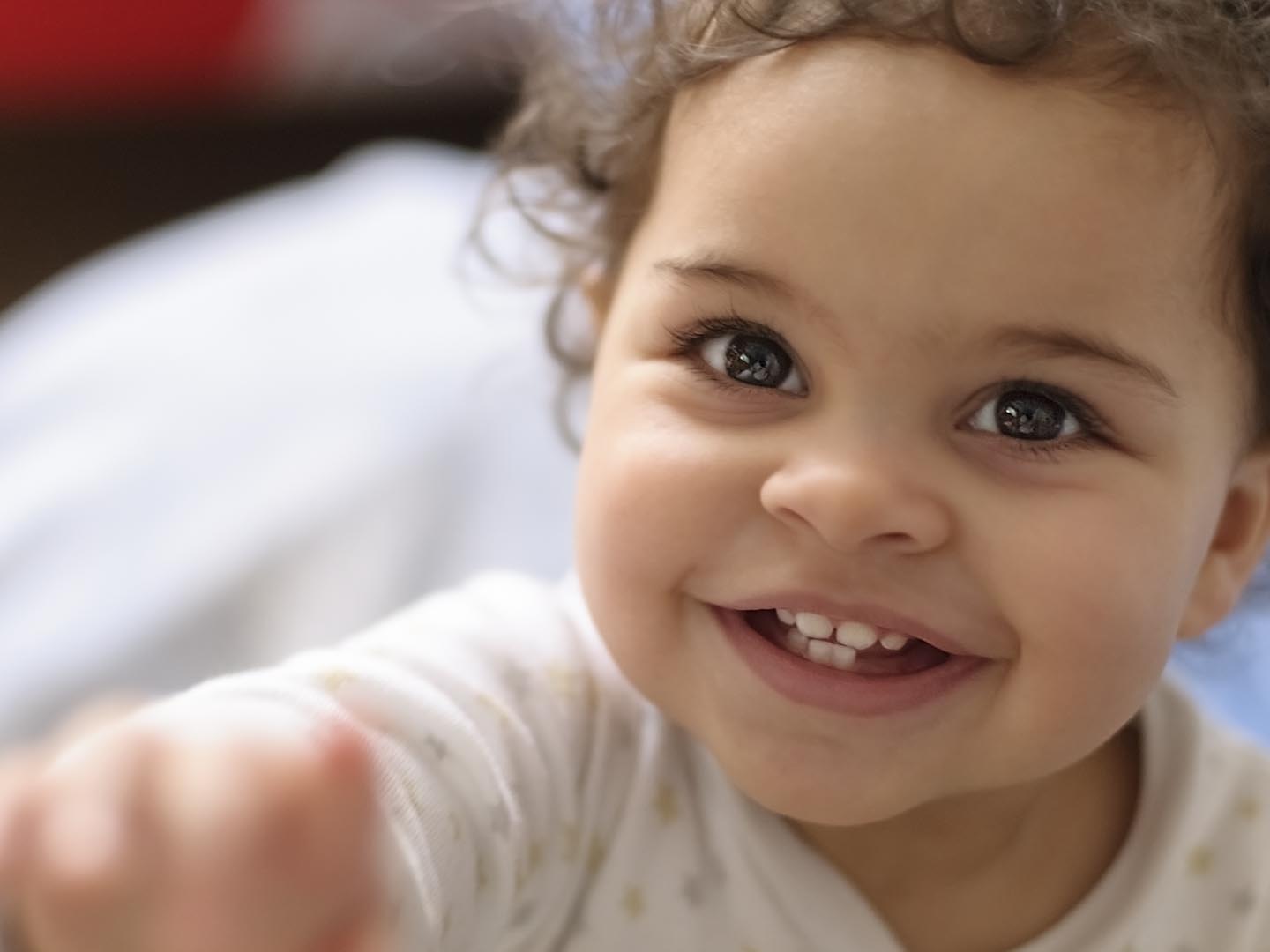 Royalty free stock photo of 2 years old baby girl headshot. This file has a signed model release. Shot in RAW, post processed in Prophoto RGB, no sharpening applied.