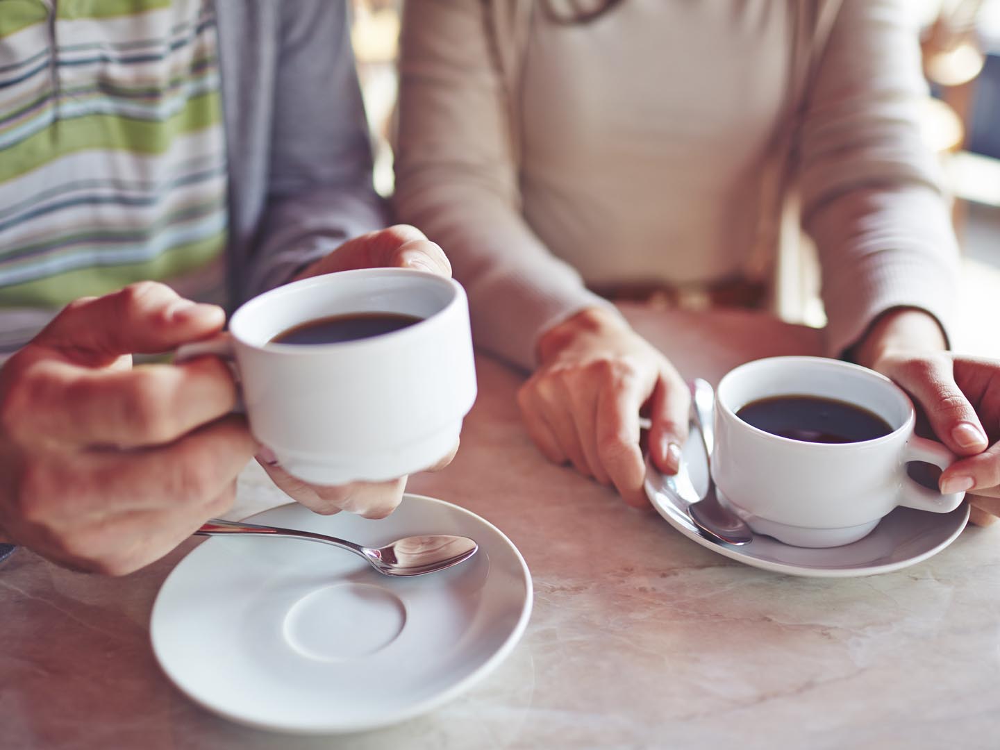 Close-up of couple drinking coffee