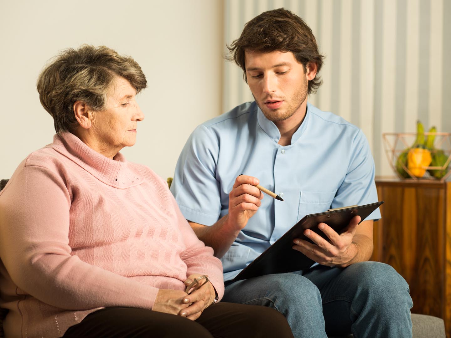 Male nurse working in rest home - horizontal view