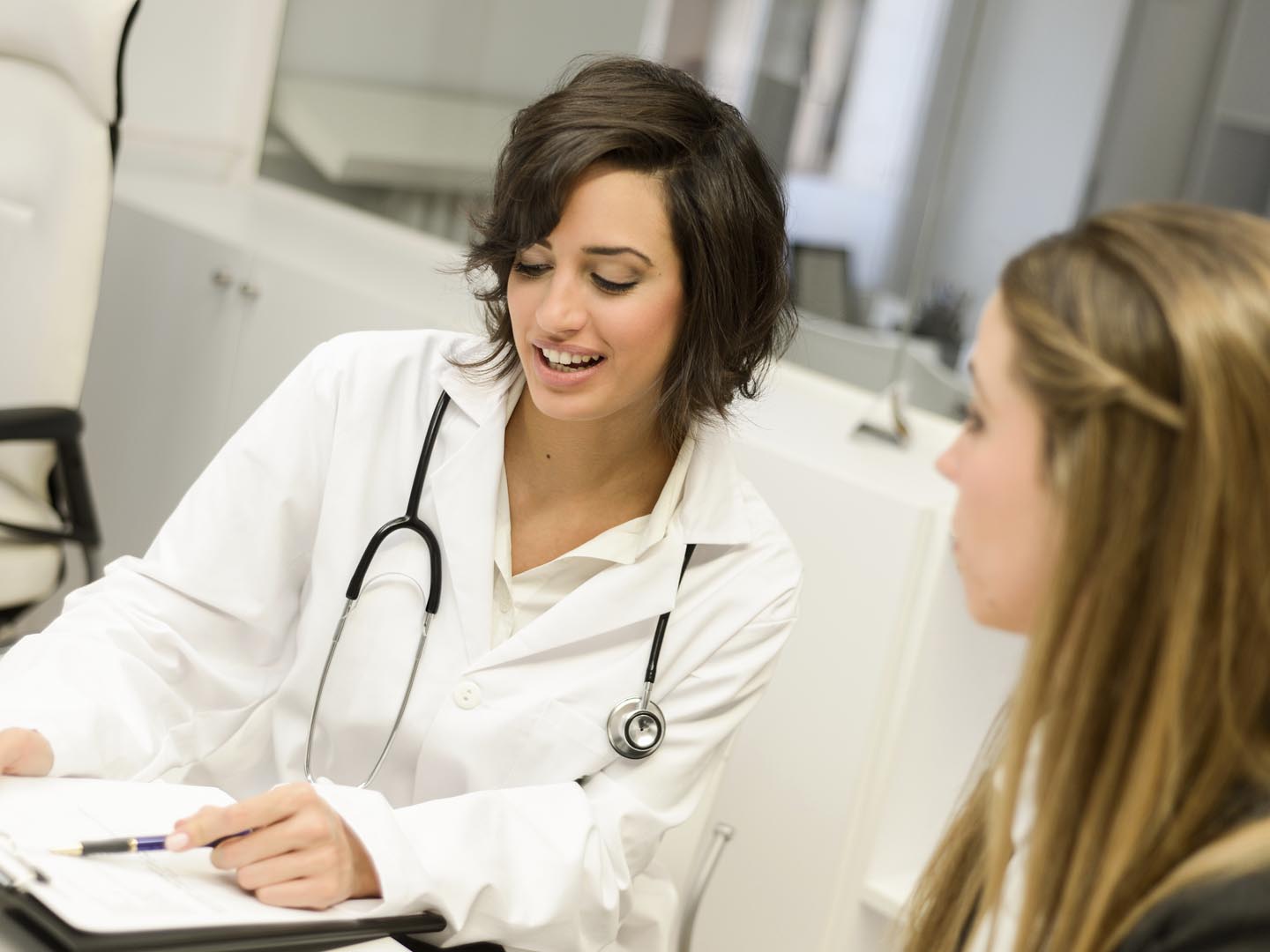 Female doctor explaining diagnosis to her female patient