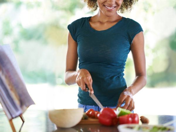 A young woman cooking from a recipe bookhttp://195.154.178.81/DATA/istock_collage/0/shoots/783564.jpg