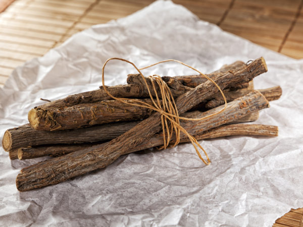 bundled liquorice sticks on wrapping paper