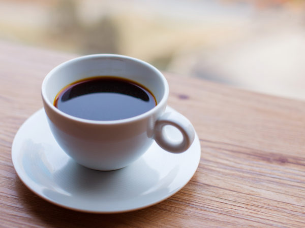 Coffee cup on the wooden table