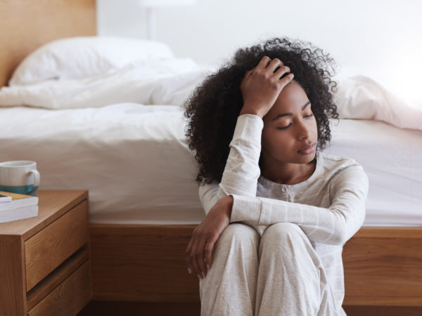 Shot of a tired young woman sitting on the floor leaning against her bedhttp://195.154.178.81/DATA/i_collage/pu/shoots/805716.jpg