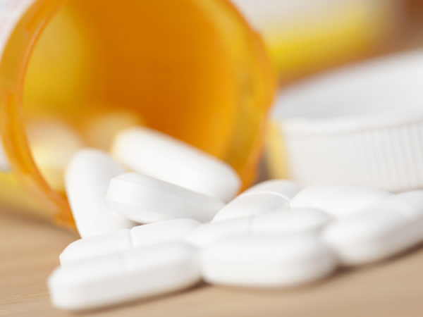 Prescription medicine spilled out of a pill bottle.