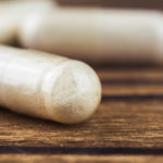 Food supplement pills, glucosamine capsules, macro image, selective focus