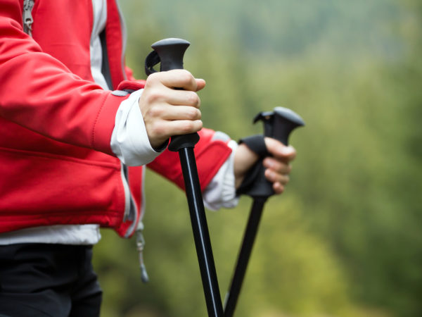 Nordic Walking in Autumn mountains, hiking concept