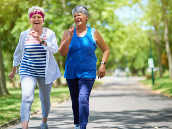 Shot of two elderly friends enjoying a run together outdoors