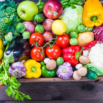 Vegetables and fruits in wood box.