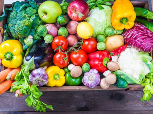 Vegetables and fruits in wood box.