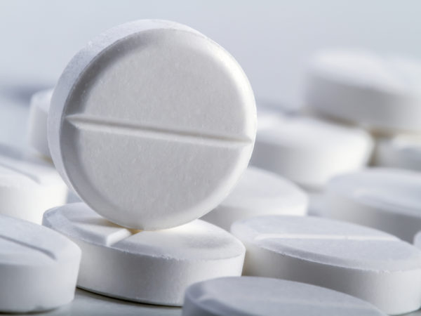 Several tablets or pills on a white background