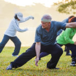 Bangkok, Thailand - FEbruary 13 2016: Unidentified group of people practice Tai Chi Chuan in a park