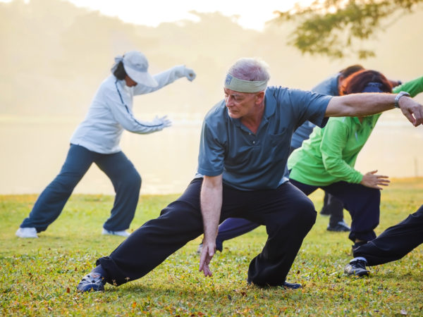 Bangkok, Thailand - FEbruary 13 2016: Unidentified group of people practice Tai Chi Chuan in a park