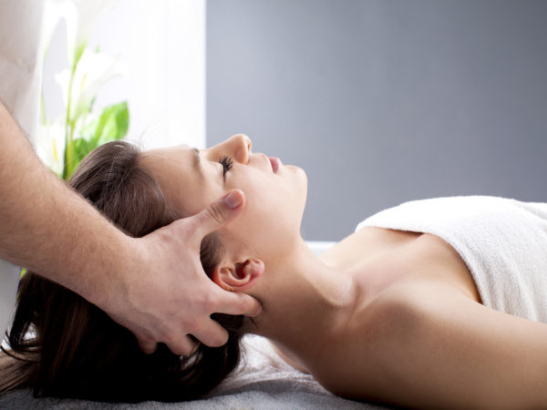 Young woman having a neck massage.