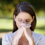 Shot of an attractive young woman looking stressed while standing outdoors