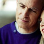 Mature couple enjoying each other, smiling and thinking.