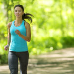 Picture of a woman jogging in a park.