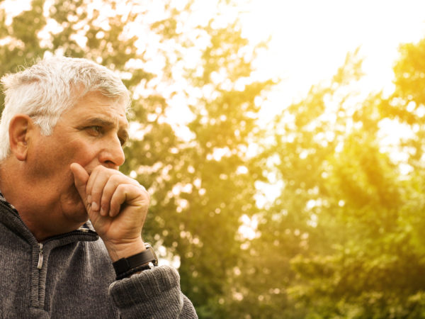 Coughing Senior Man on fresh air.