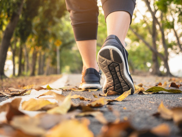 Woman walk in park outdoor Trail exercise Healthy lifestyle Autumn fall