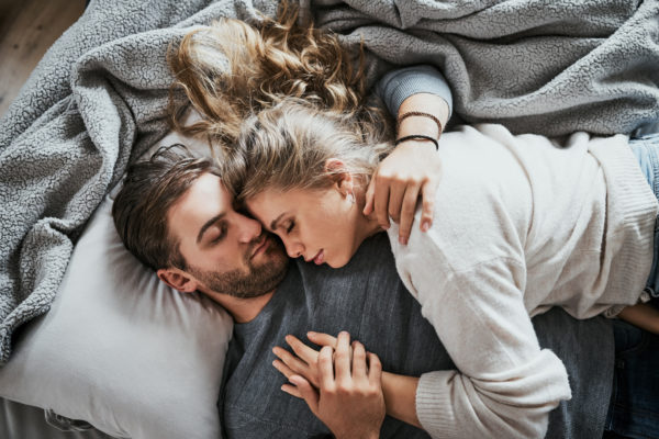 Couple_Hug_Bed_Grayblankets