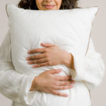 Img_Pillows_DrWeil_AllSeasonsWool_ModelHug_Purecare