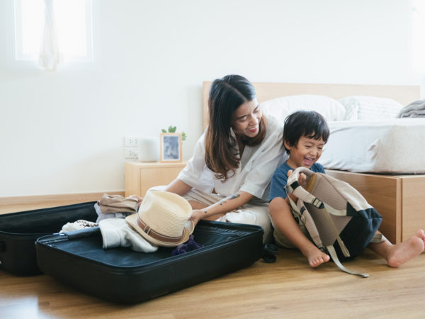 Young asian mother and son getting ready to vacation