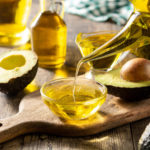 Avocado oil on wooden table