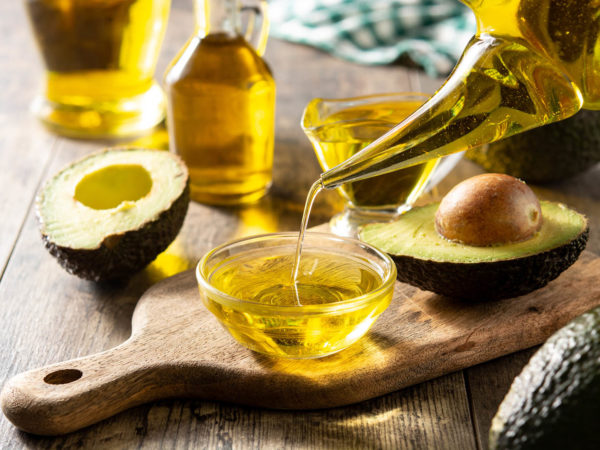 Avocado oil on wooden table